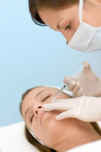 Botox injection - Woman in cosmetic medicine treatment